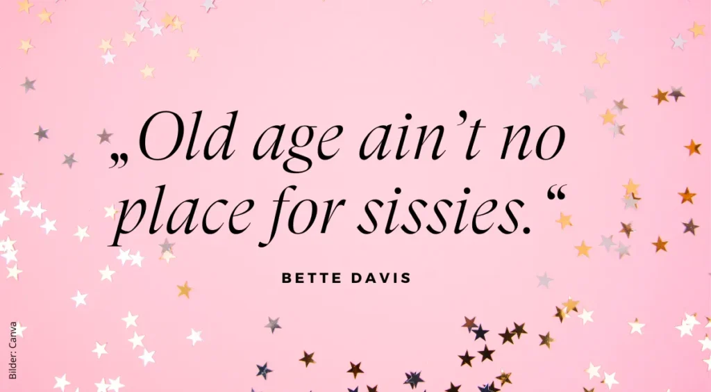 Eine rosa Karte mit kleinen silbernen Sternchen und einem Zitat zum Geburtstag von Bette Davis